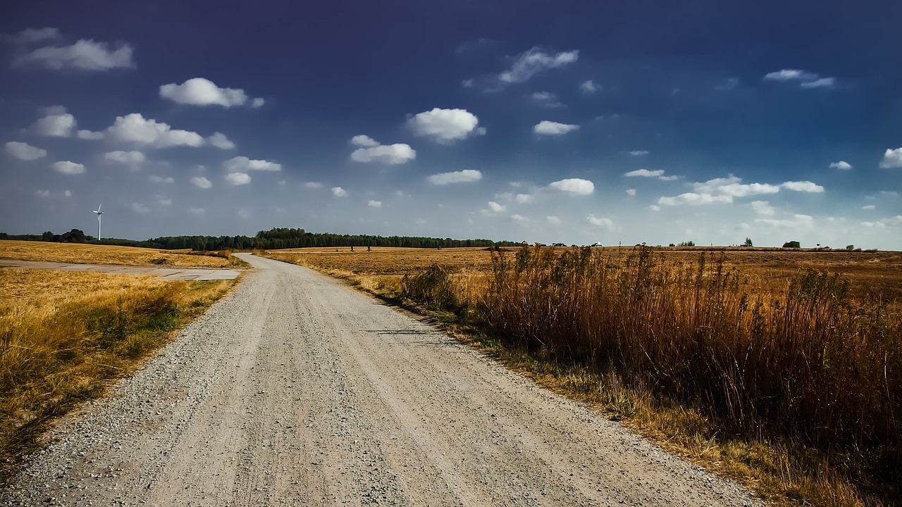 clouds countryside dirt road free photo
