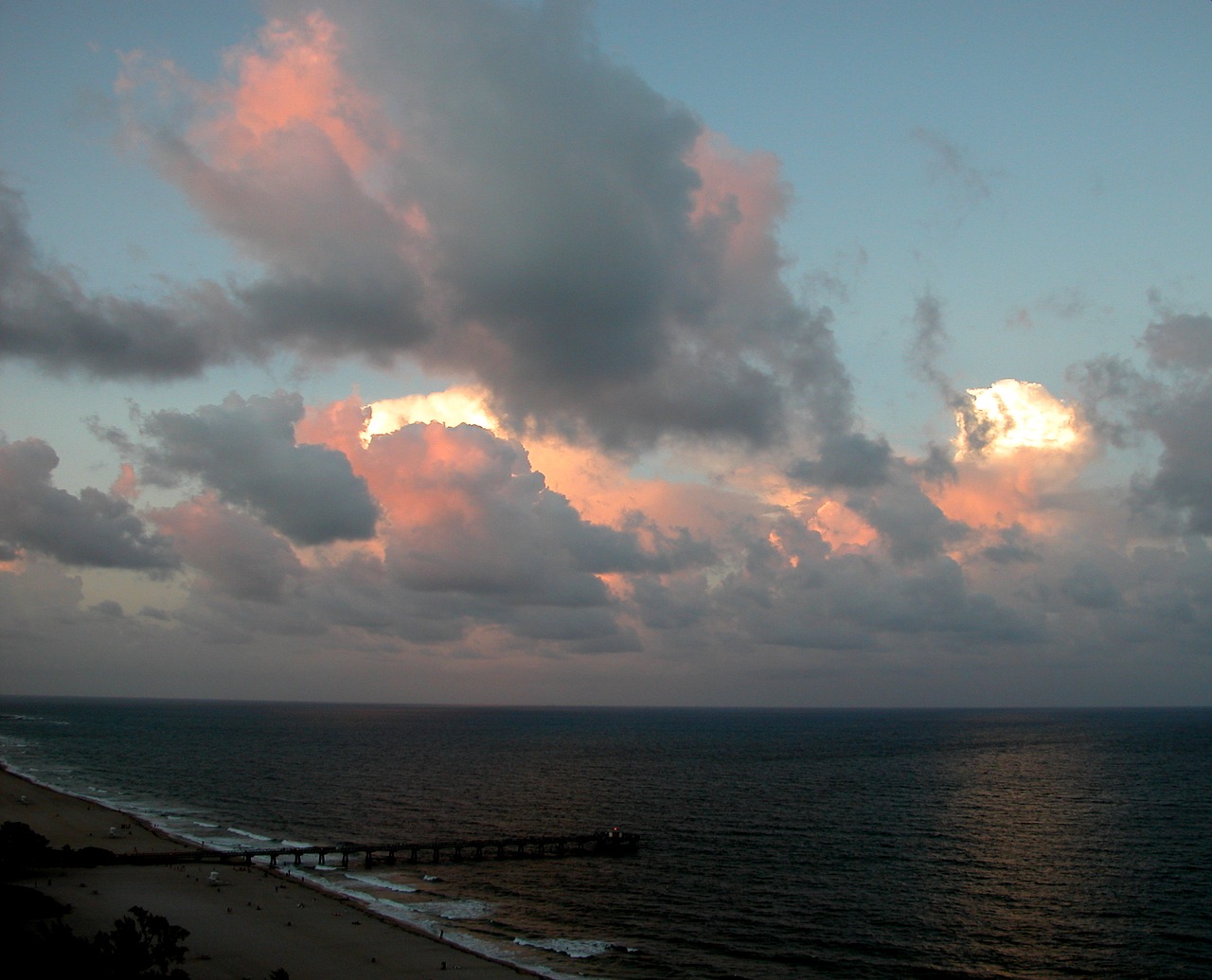 clouds clouds over atlantic ocean pier free photo