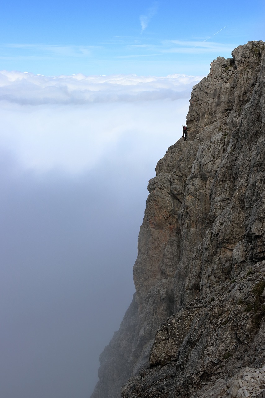 clouds  rock  climber free photo