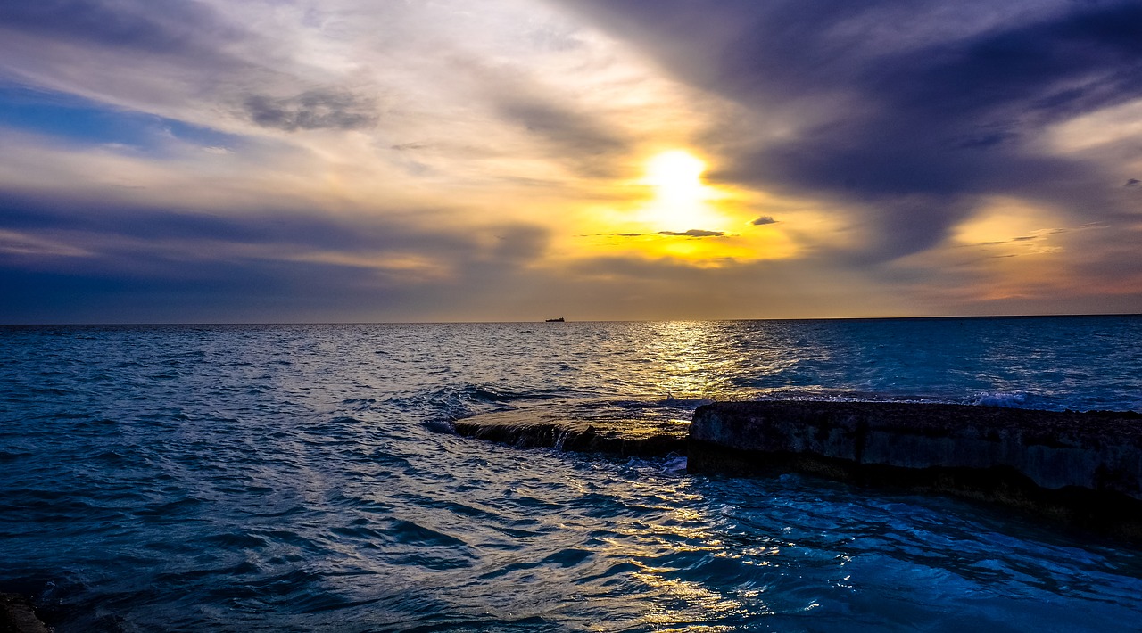 cloudy clouds ray of sunshine sea free photo