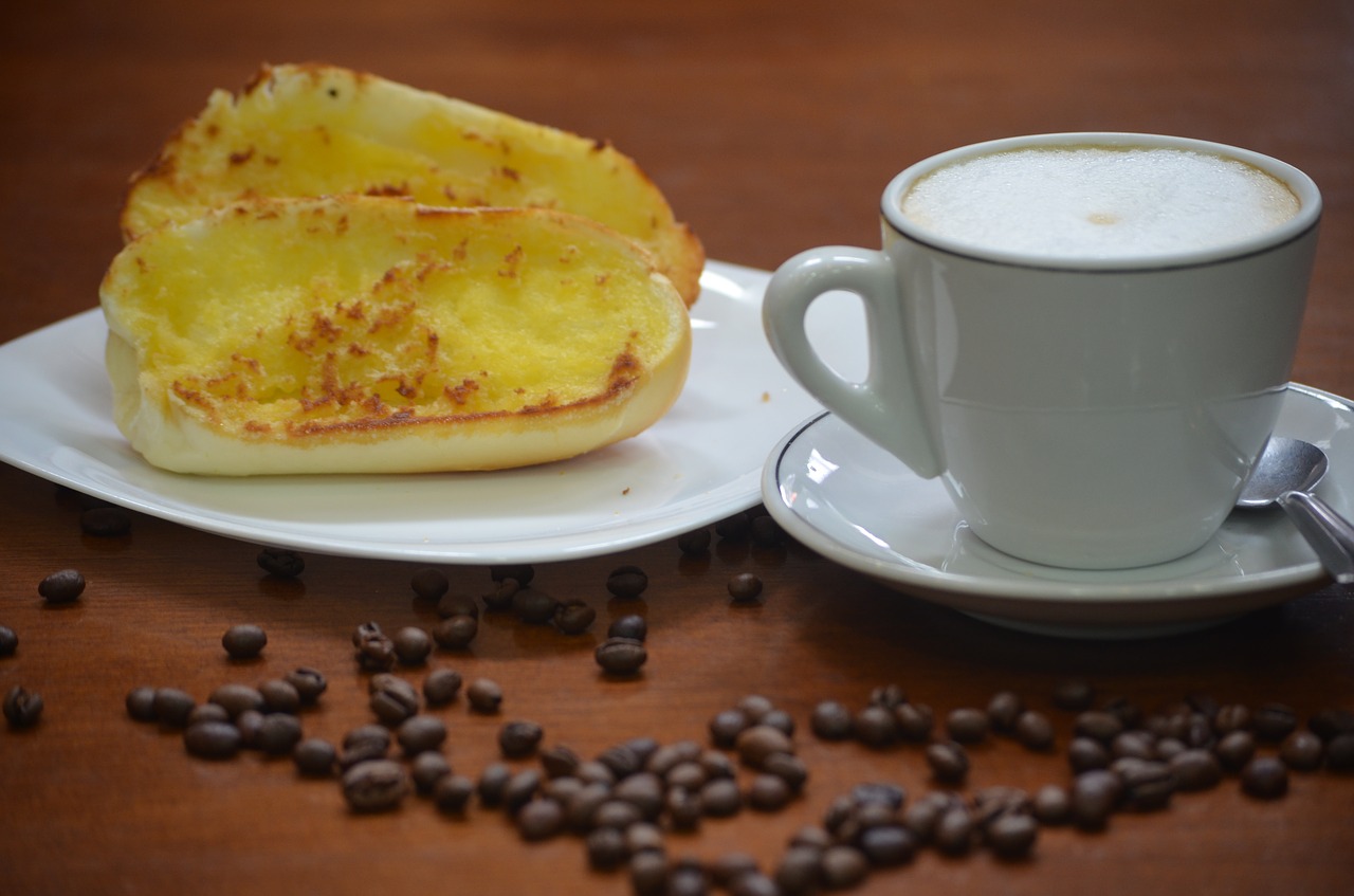 coffee with milk bread and butter breakfast free photo
