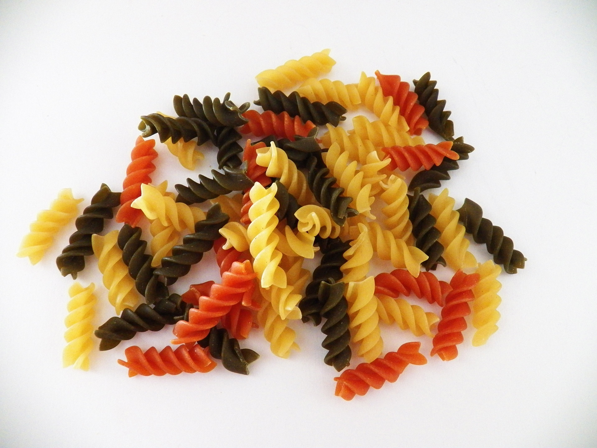 colored pasta pasta pasta twirls free photo