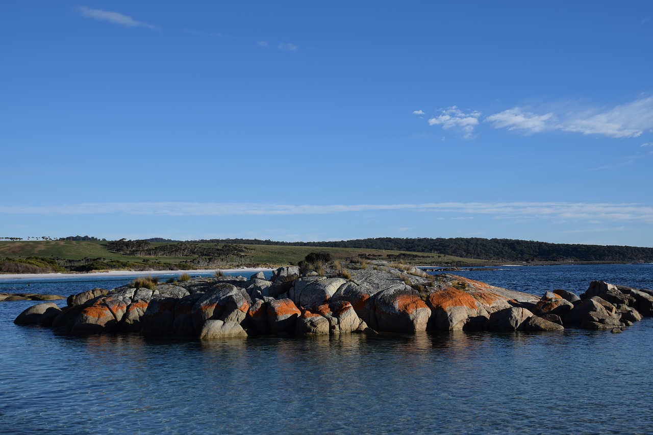colorful rocks crystal clear water bay of fires free photo