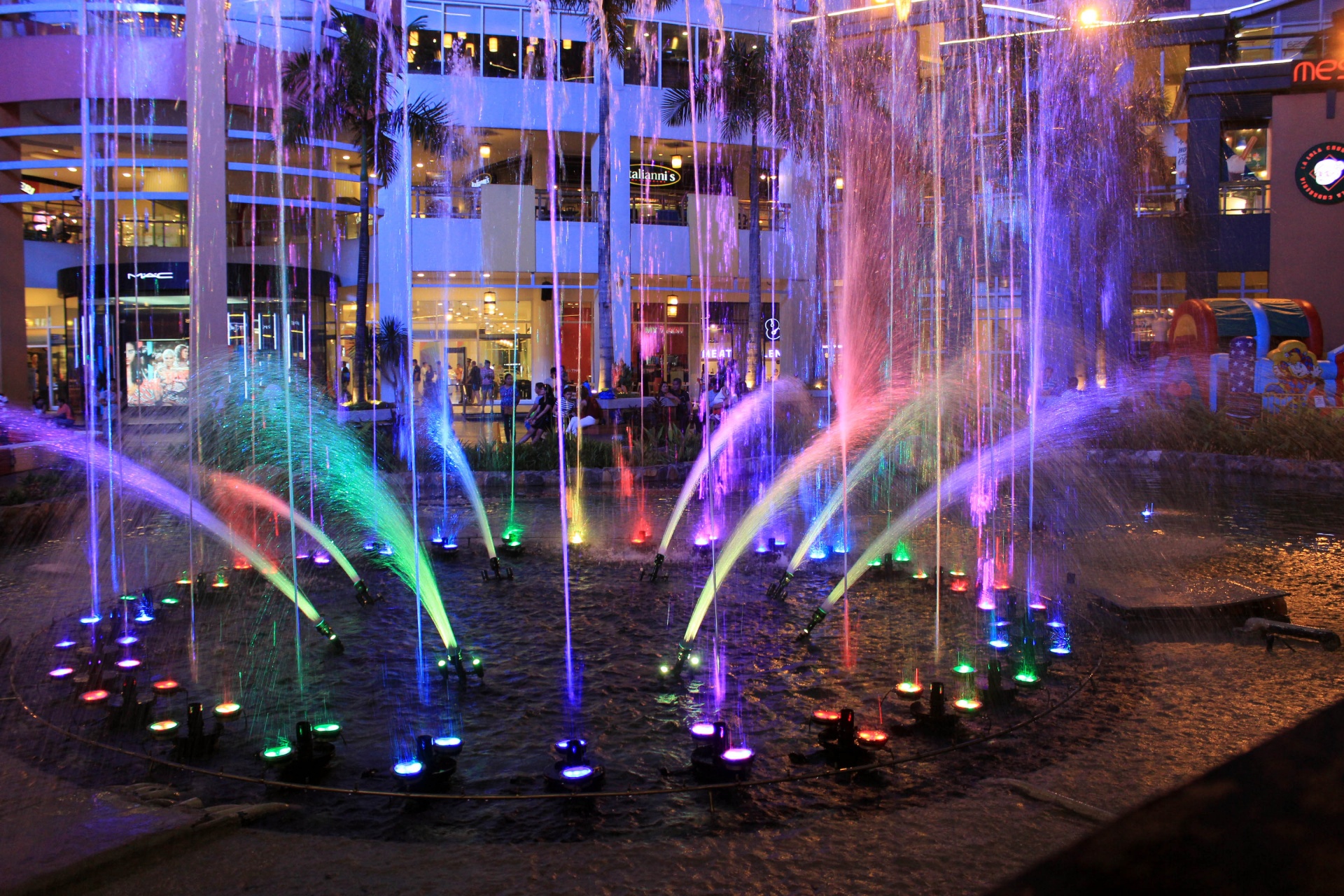 colorful water fountain colorful water fountain free photo