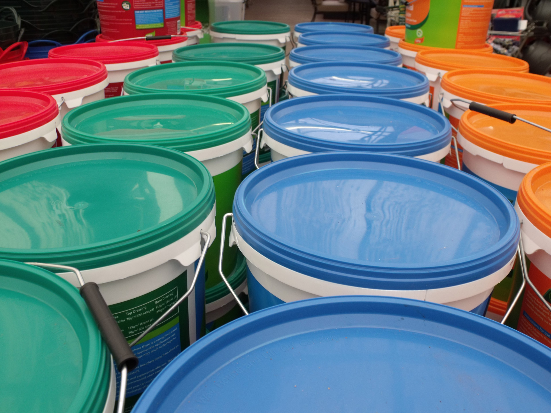 blue green red and orange coloured tubs coloured tubs free photo