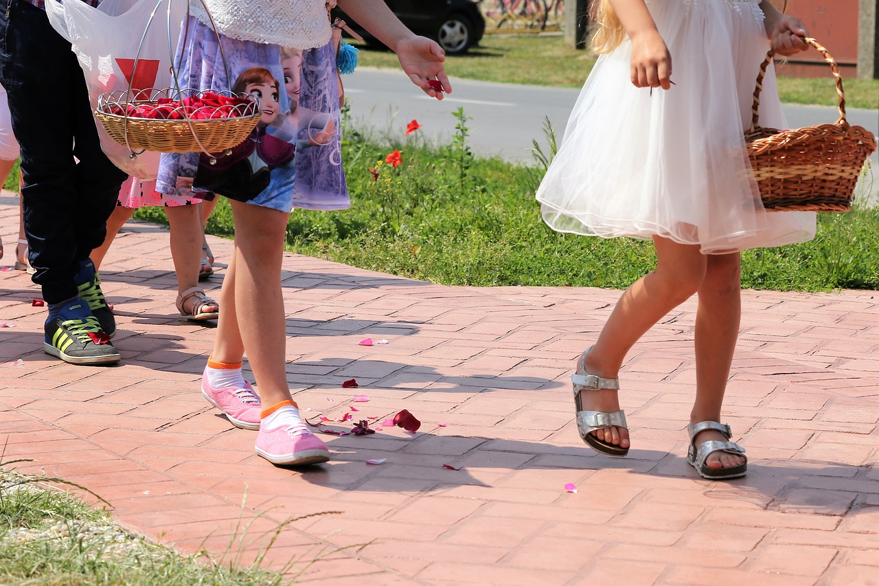 corpus christi feast  girls throwing rose petals  procession free photo