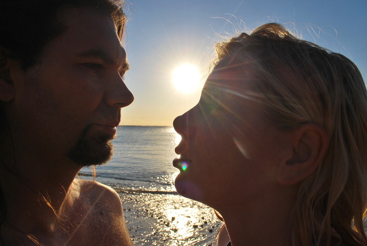 couple sunset beach free photo
