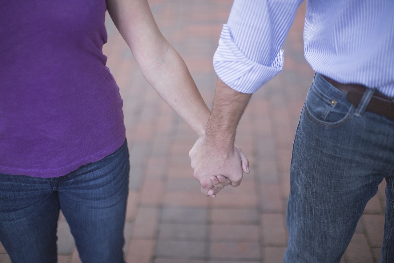 couple hand in hand valentine's day free photo