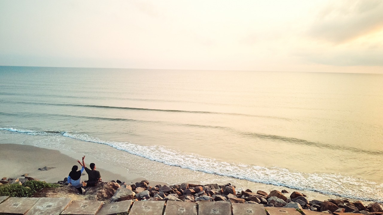 couple  sunrise  beach free photo