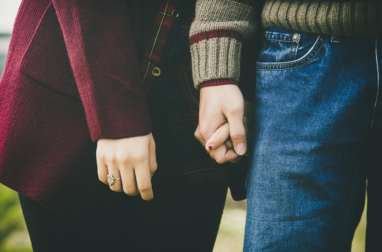 couple holding hands love free photo