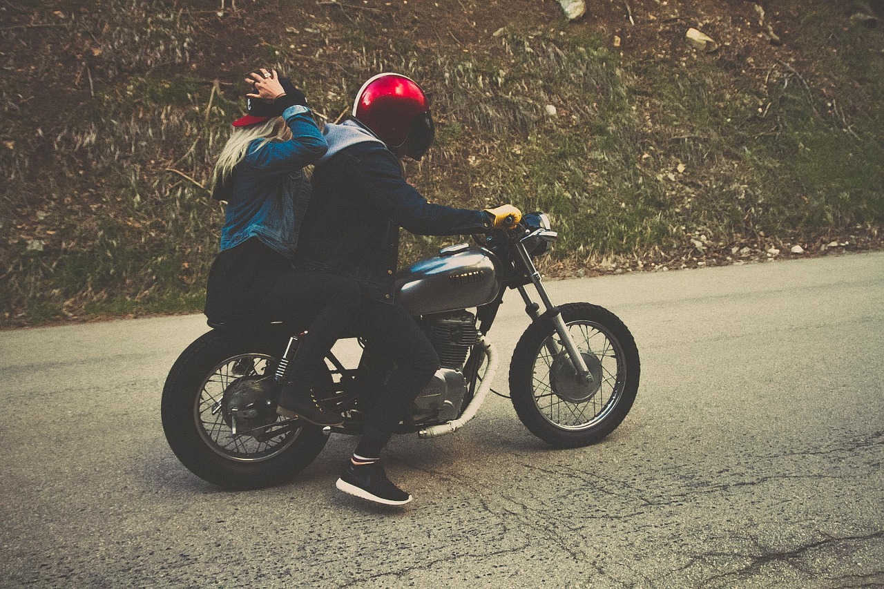 couple driving motorcycle free photo