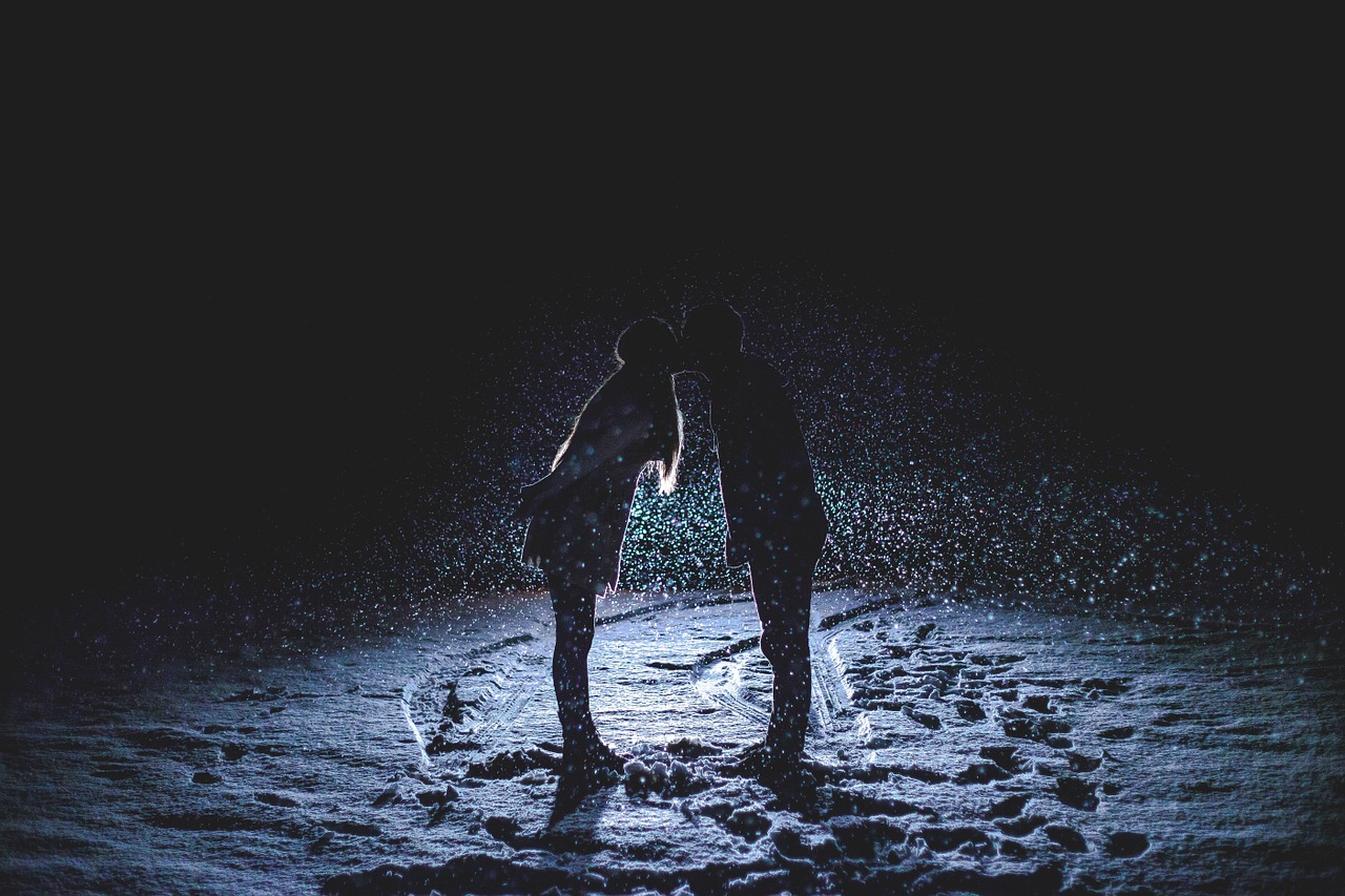 couple kissing snowy night snowing free photo