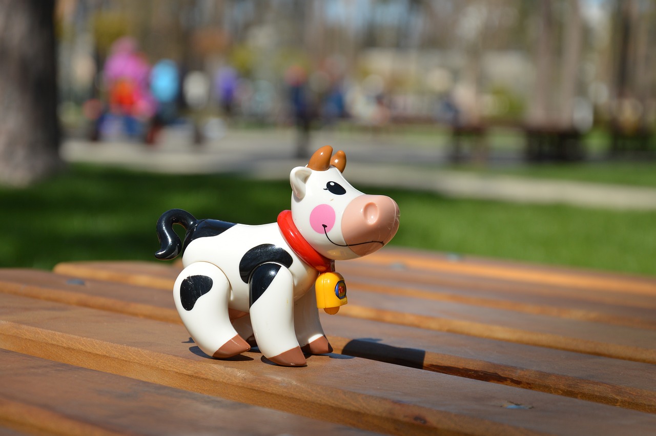 cow toy bokeh free photo