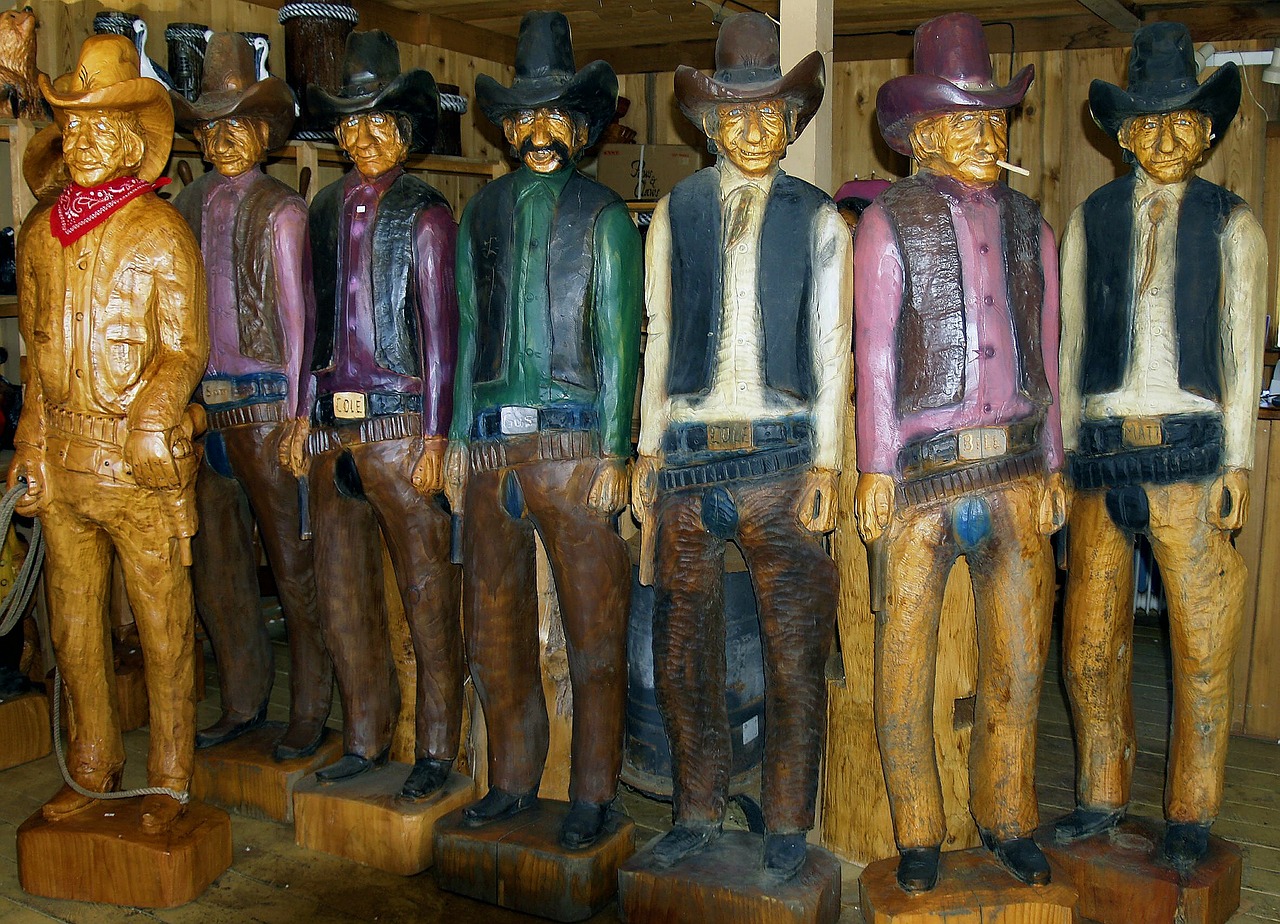 cowboys wood carving artwork free photo