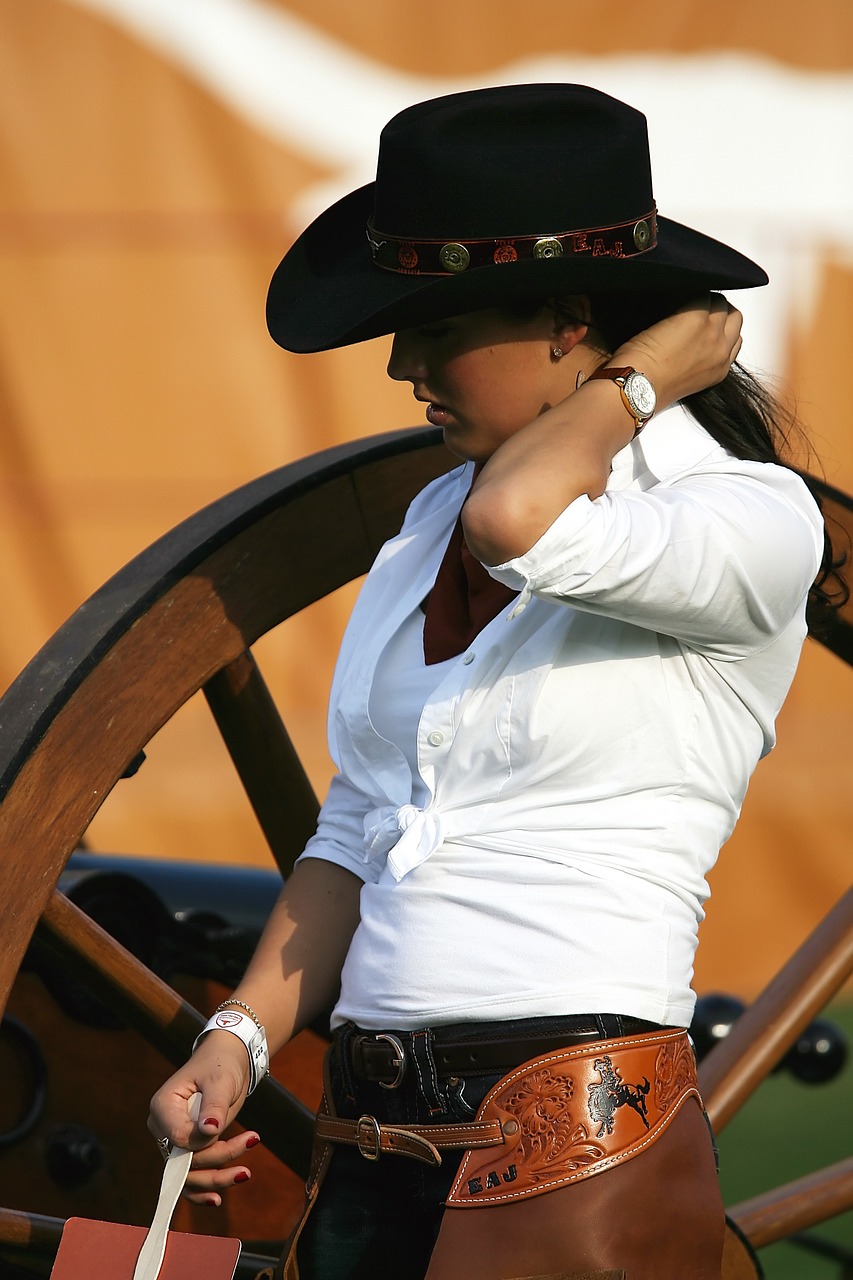 cowgirl cowboy hat wagon wheel free photo