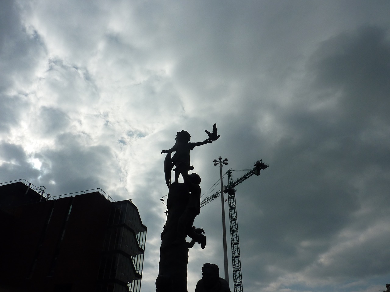 cranes grey sky sky free photo