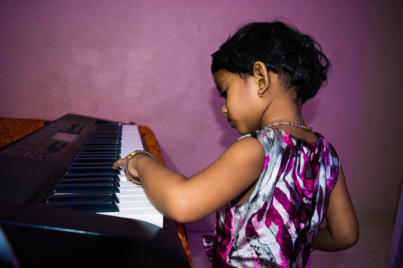 cute girl playing piano little girl piano free photo