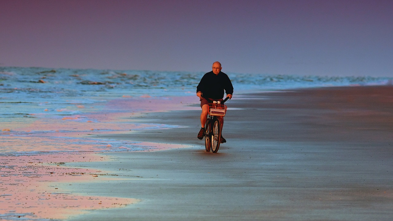 cyclist  beach  morning free photo