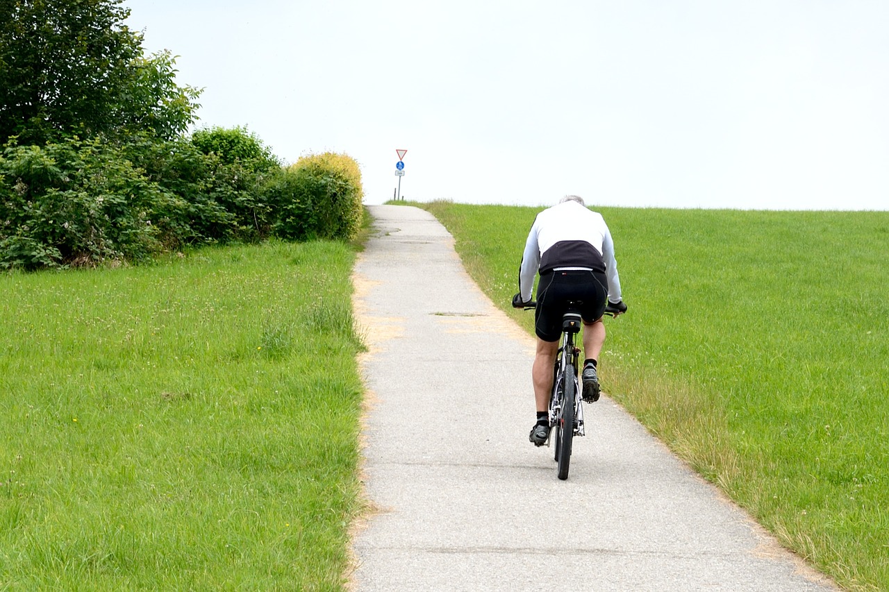 cyclists drive bike free photo