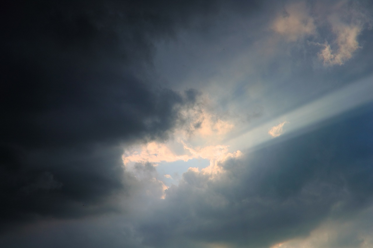dark clouds rays of the sun clouds free photo