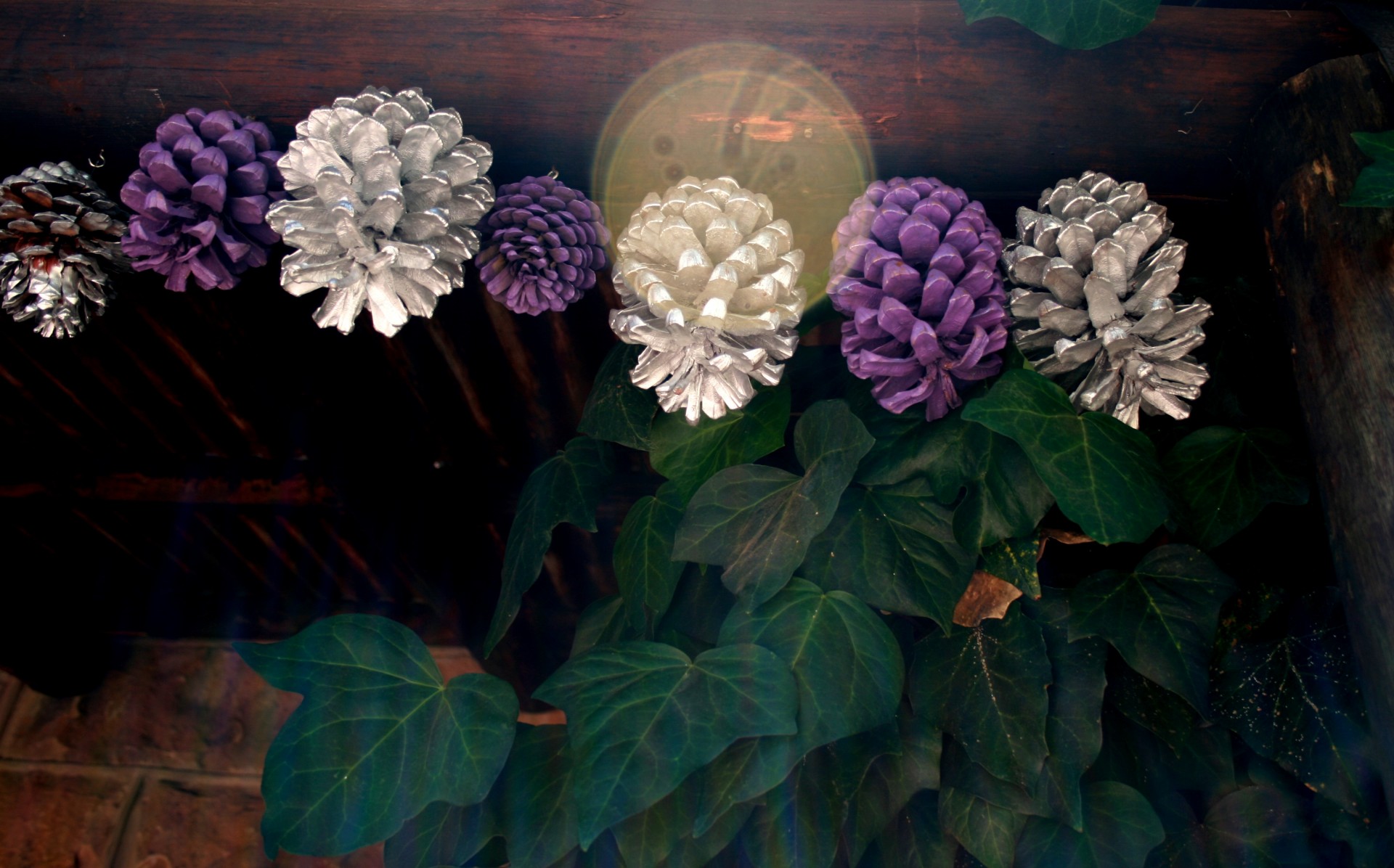 pine cones painted silver purple strung pine cones free photo