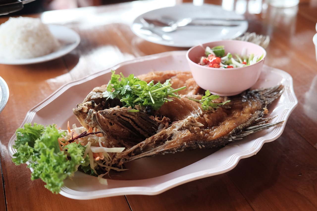deep fried snapper with fish sauce  deep fried fish  fish free photo
