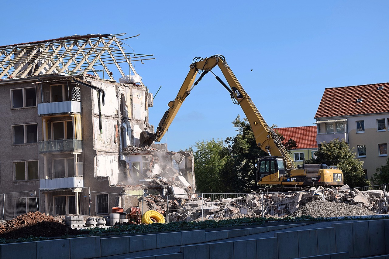 demolition excavators building rubble free photo