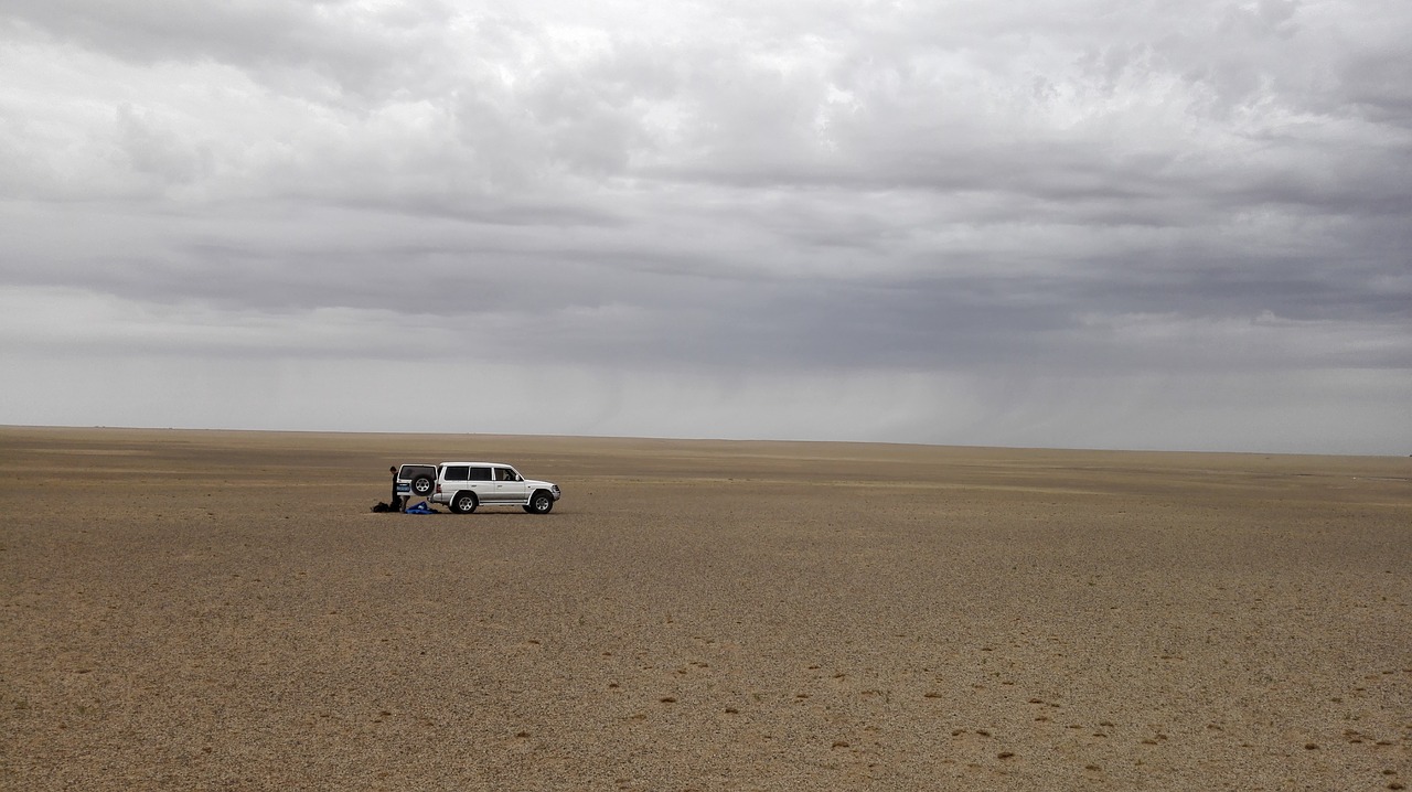 desert  dark clouds  off road buggy free photo