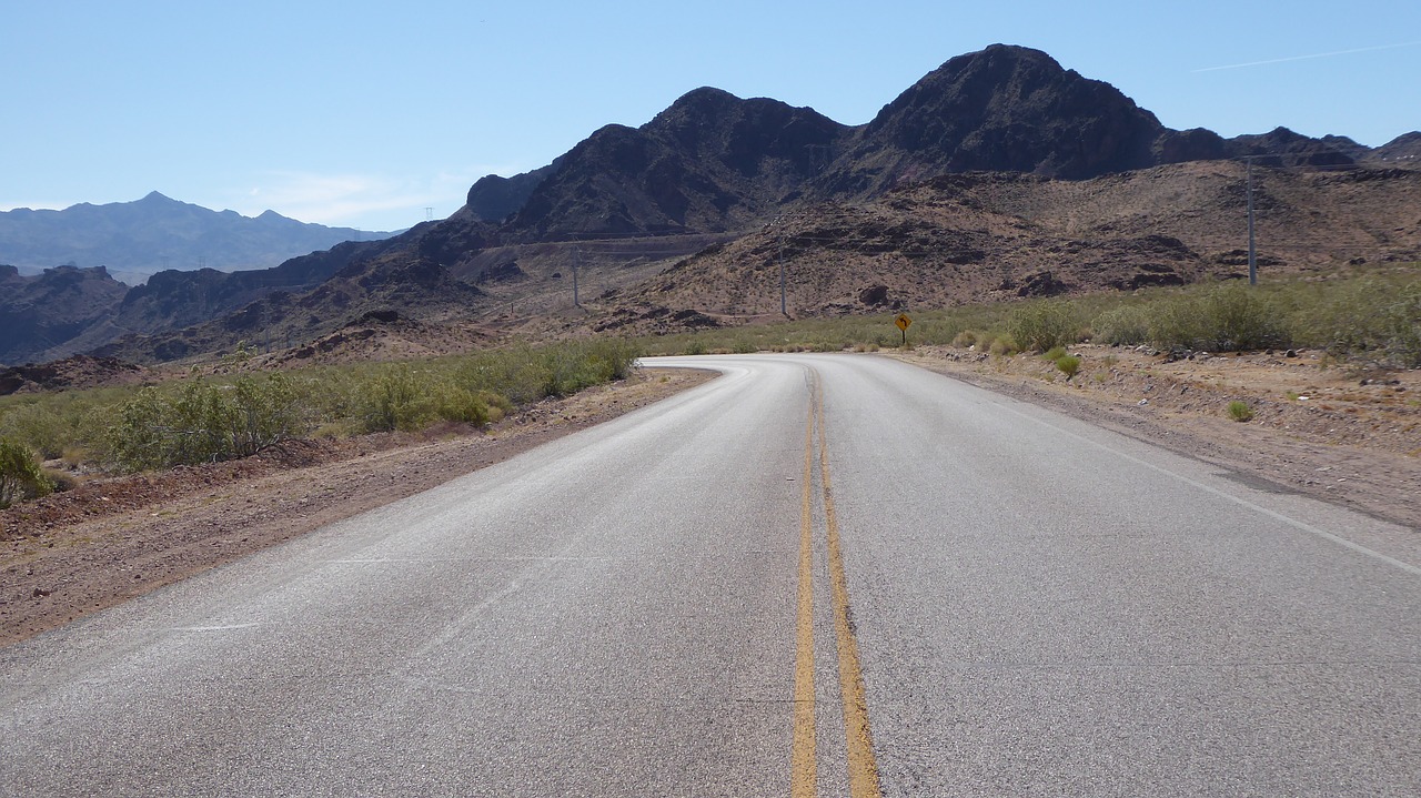 desert highway asphalt yellow double line free photo