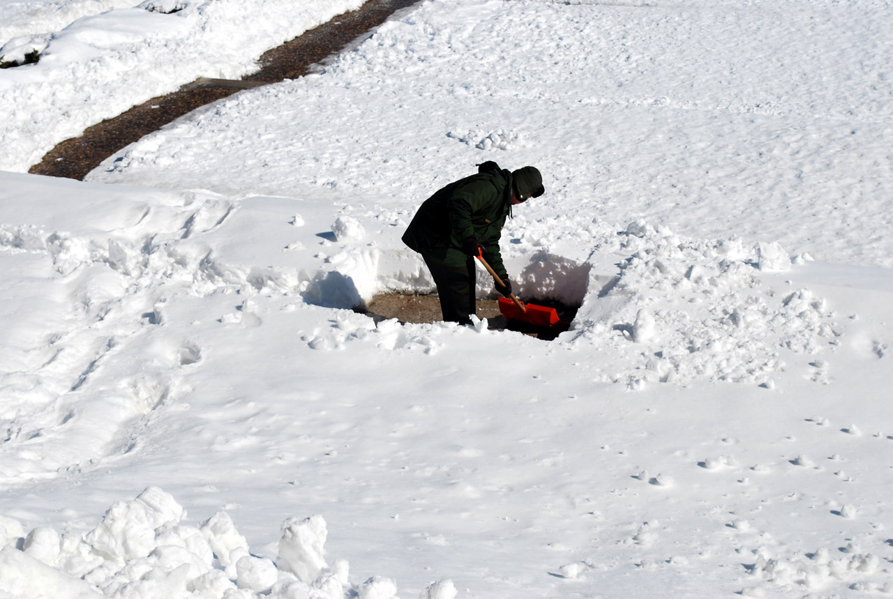snow shoveling man free photo