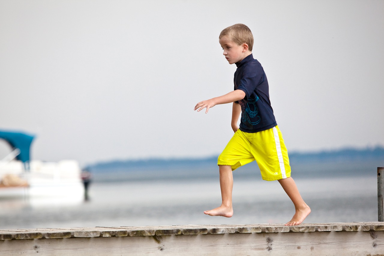 dock young boy running free photo