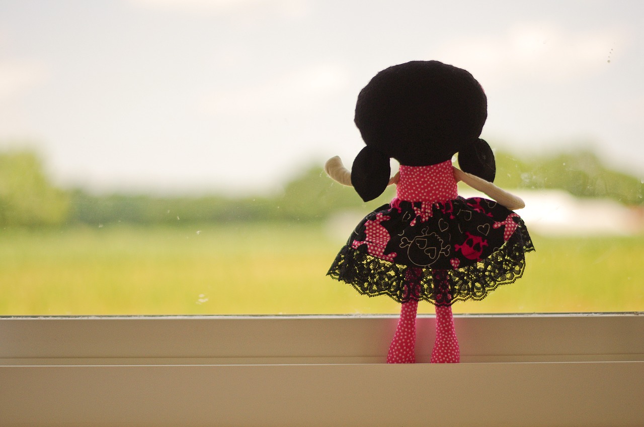 doll looking out pink free photo