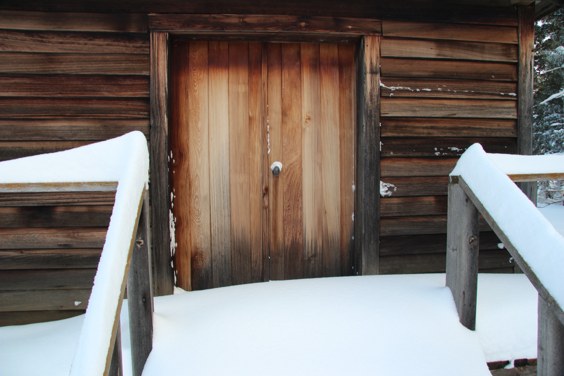 wooden door snow free photo