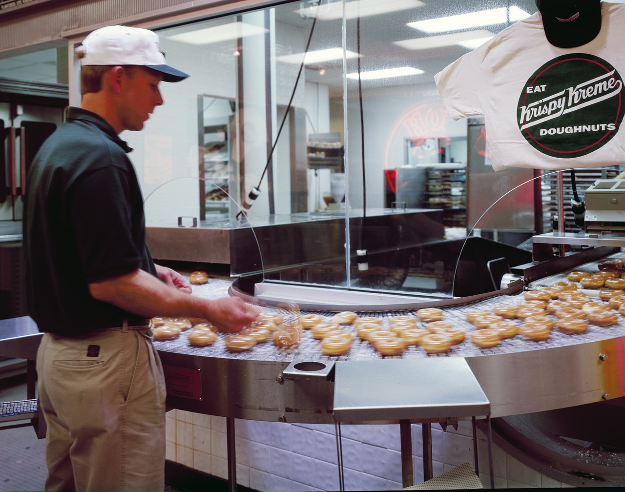 doughnut maker cooking donuts free photo
