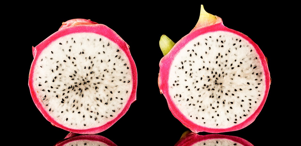 dragon fruit  isolated  on black background free photo