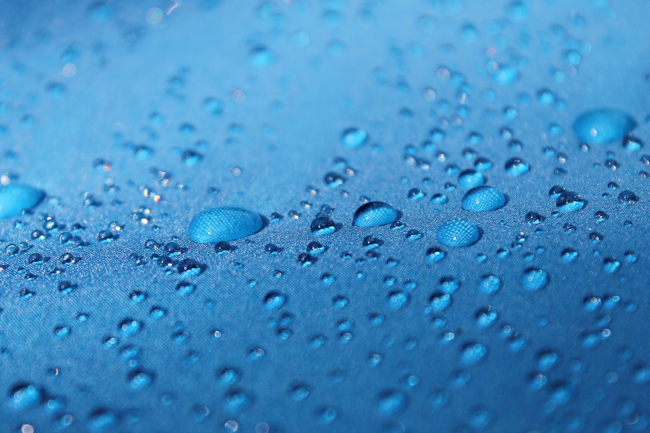 drops  blue background  raindrops free photo