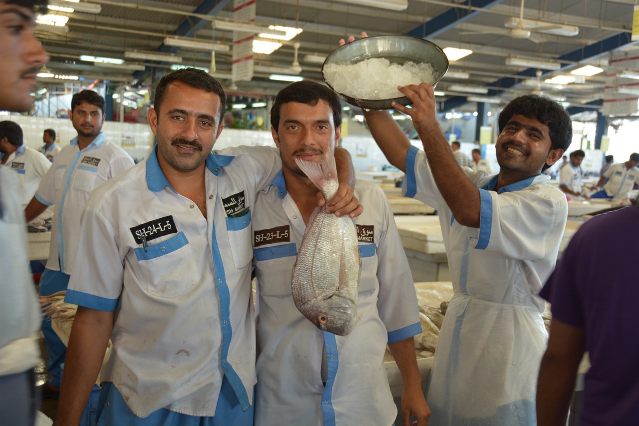 dubai fish market workers free photo