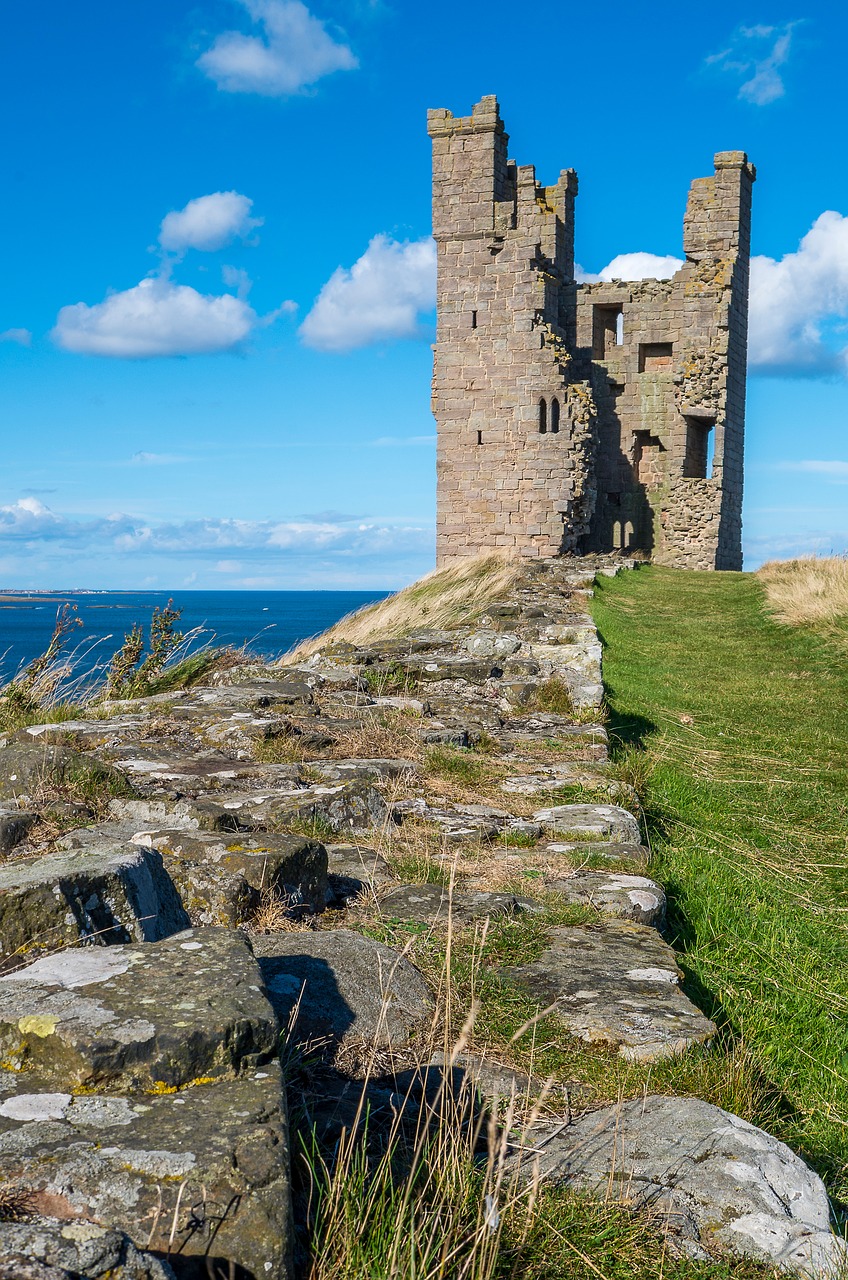 dunstanburgh castle  ruin  tower free photo