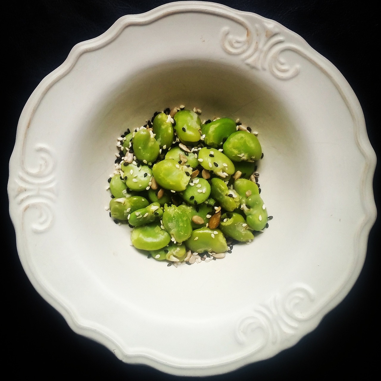 eating broad bean seeds free photo