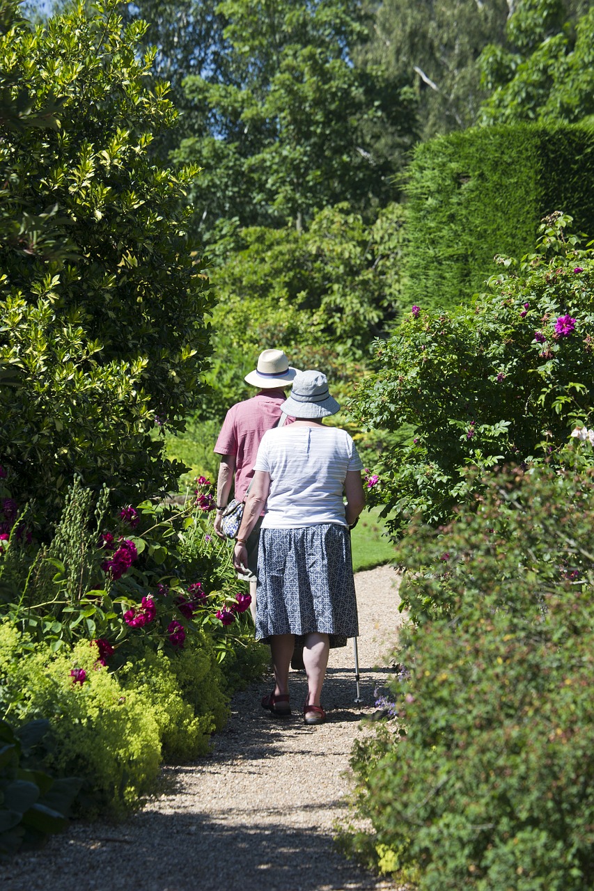 elderly couple garden path walking free photo