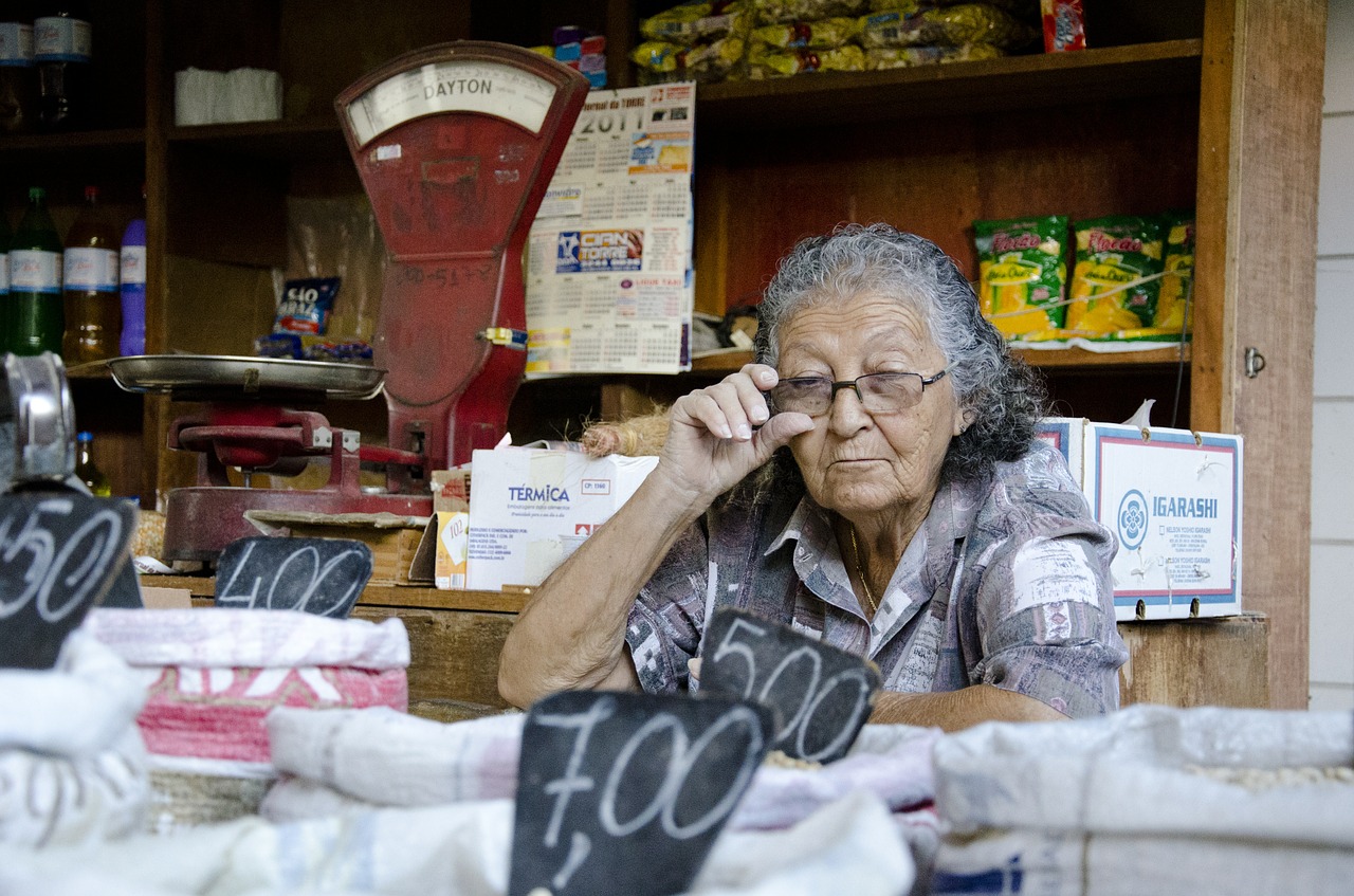 elderly woman seller market free photo