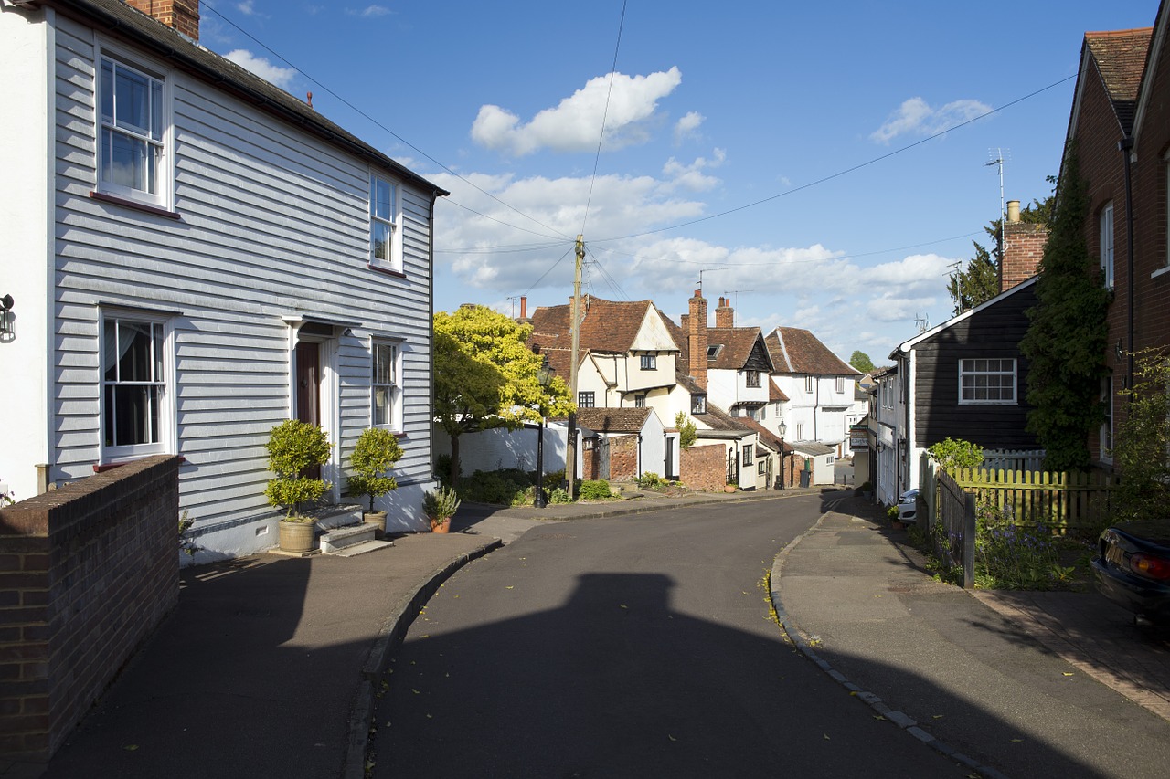 english village street scene eclectic architecture telegraph pole free photo