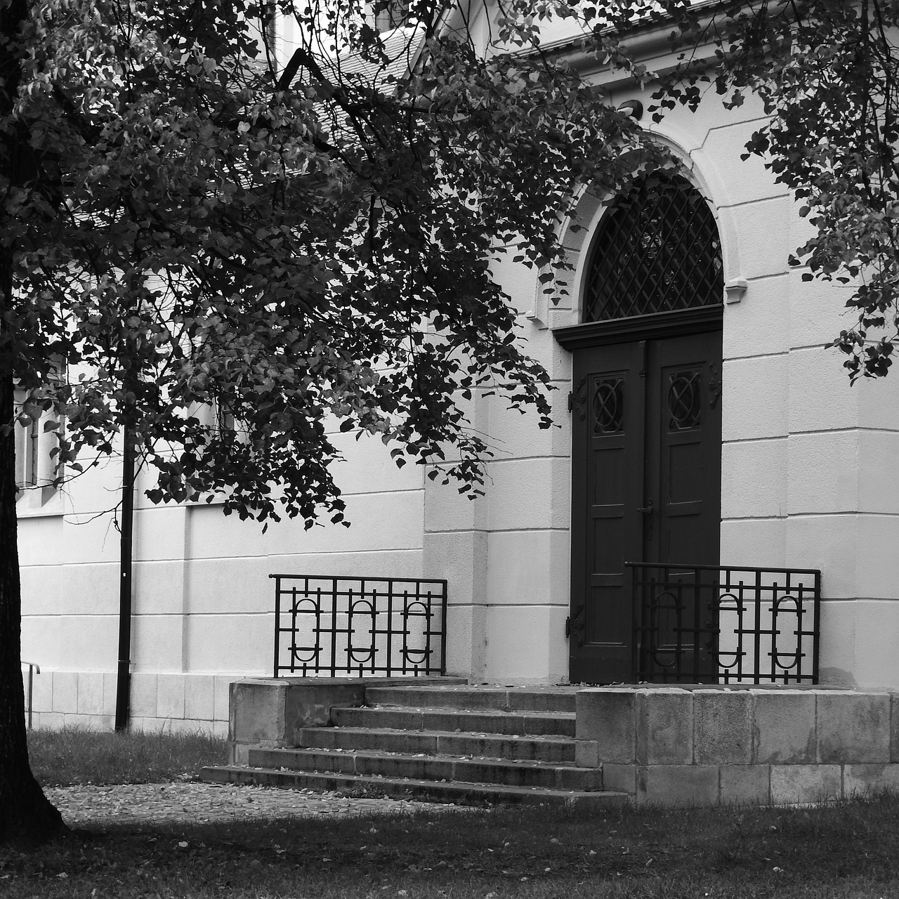 entrance to the church gate banded doors free photo