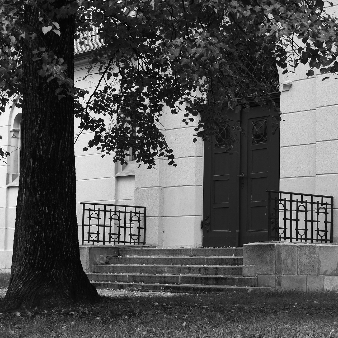 entrance to the church gate banded doors free photo