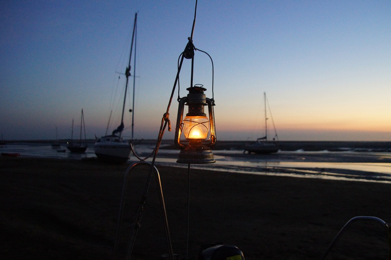 evening  north sea  kerosene lamp free photo