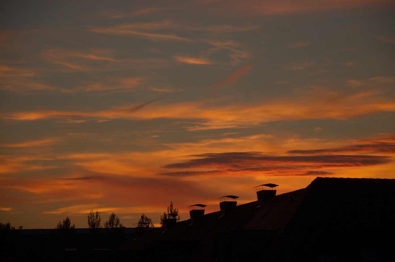 evening sky sunset roofs free photo