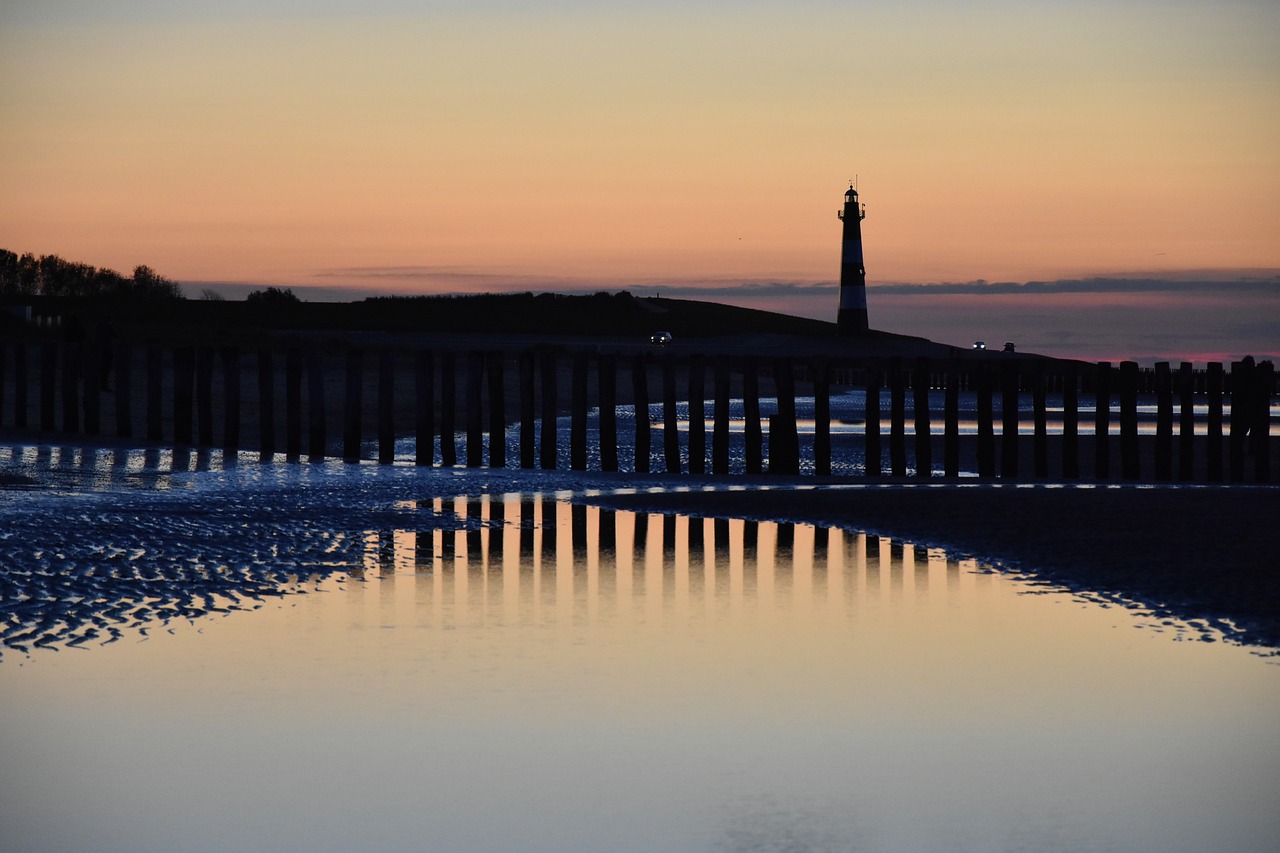 evening sun lighthouse mirroring free photo