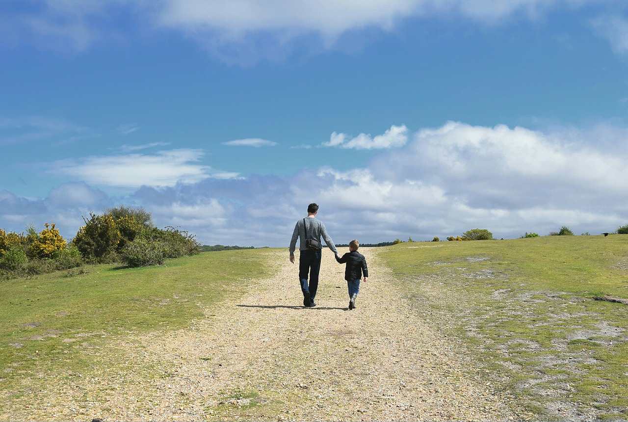 family father and son walking free photo