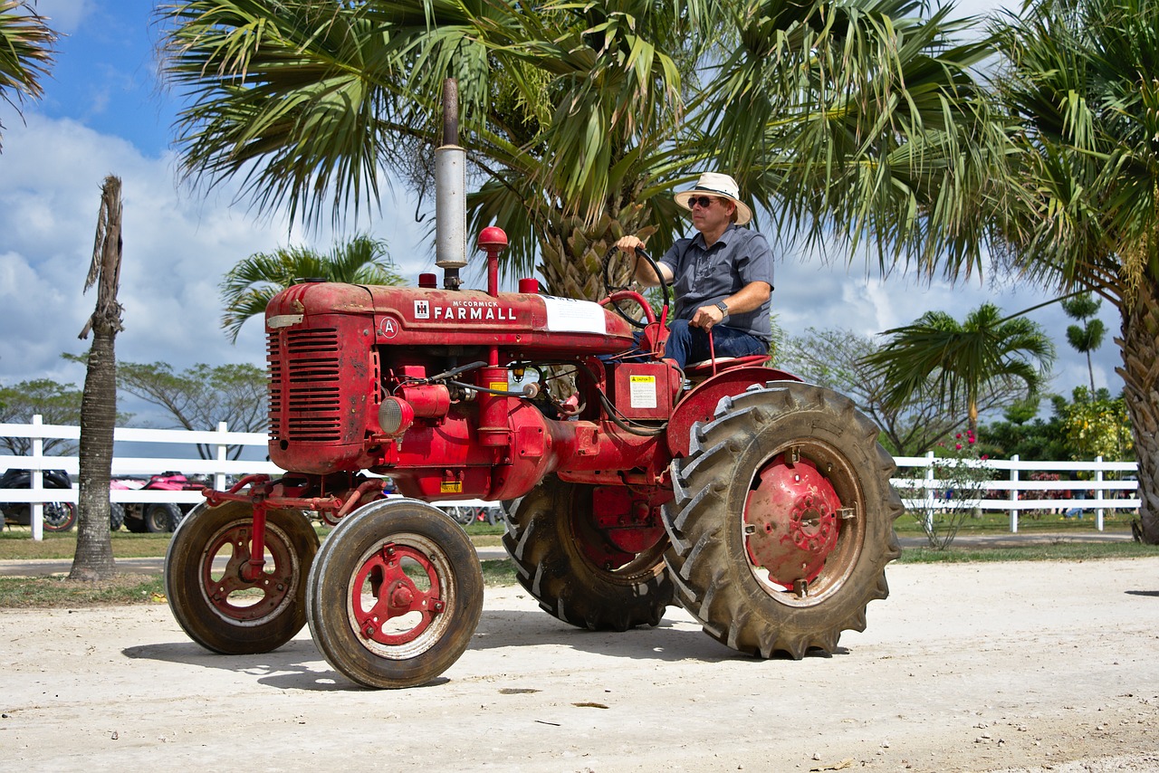 farmer shifting tractor free photo