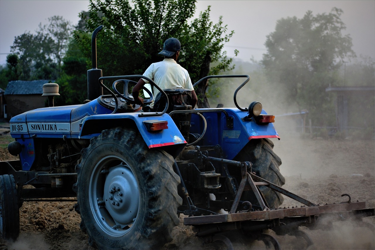 farmer  tractor  ploughing free photo